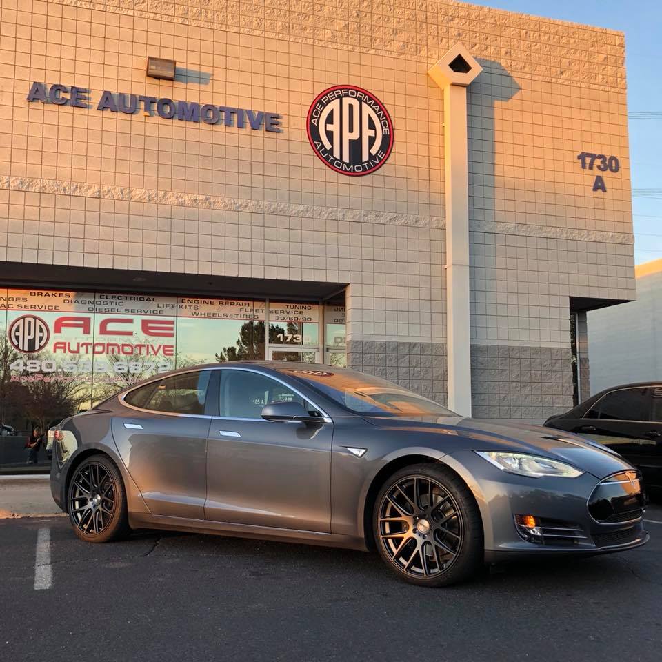 Grey Tesla with Custom Dark Grey Rims and Ace Automotive in the background