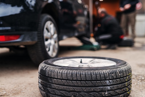 Picture of car tire in auto shop
